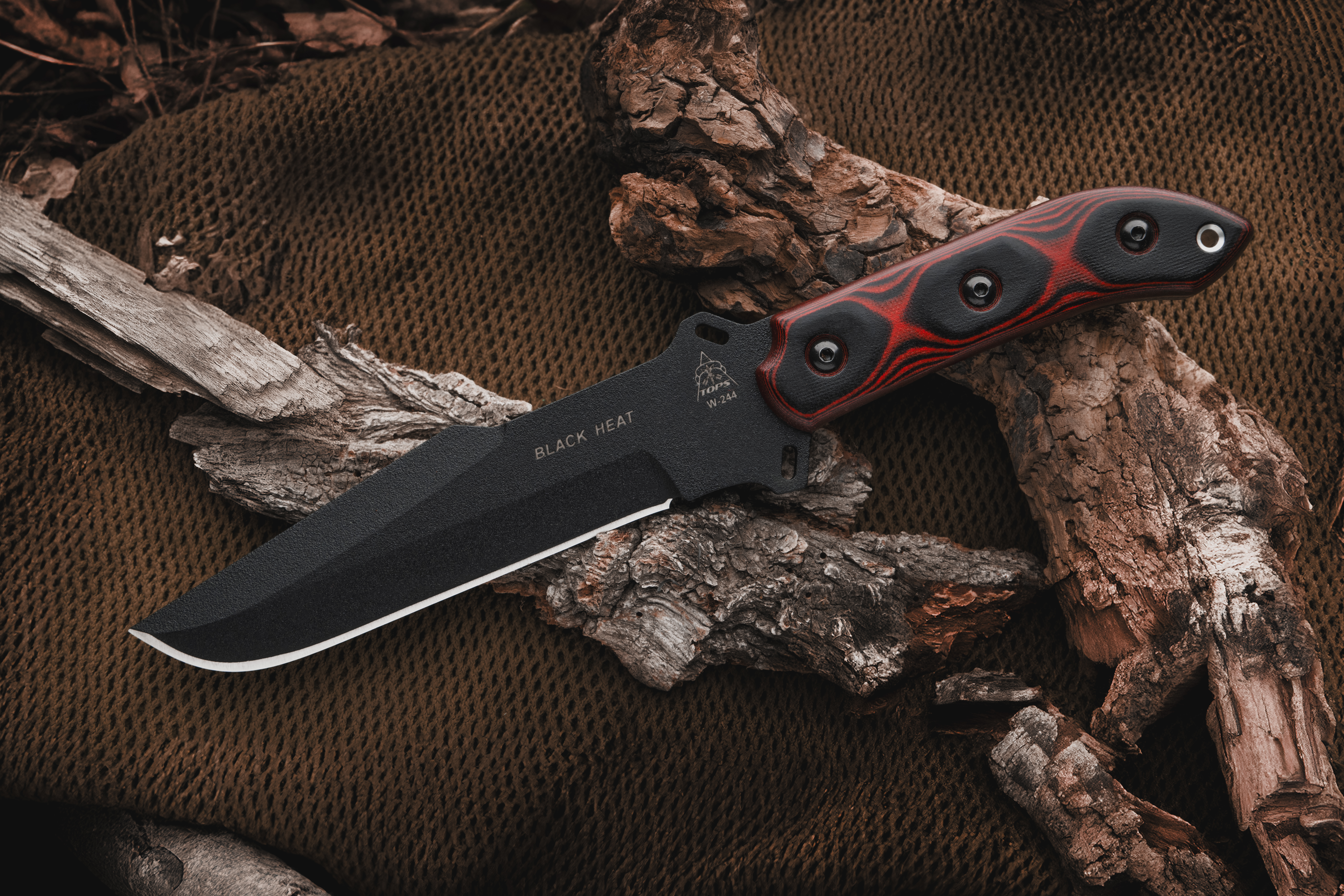 TOPS Black Heat fixed blade knife — 5.75″ 1095 carbon steel blade with black heat-treat finish and Micarta handle.