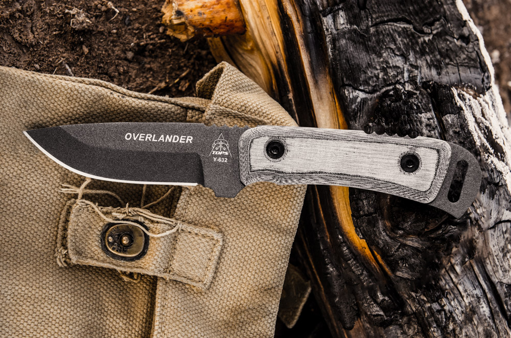 TOPS Overlander fixed blade knife with 1095 carbon steel drop point blade, gray traction coating, and black linen Micarta handle.